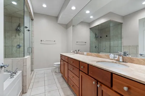 a bathroom with a bathtub and shower