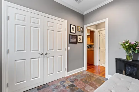 a large kitchen with stainless steel appliances granite countertop a stove and a wooden floors