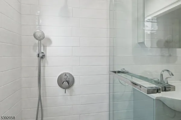a bathroom with a shower and sink
