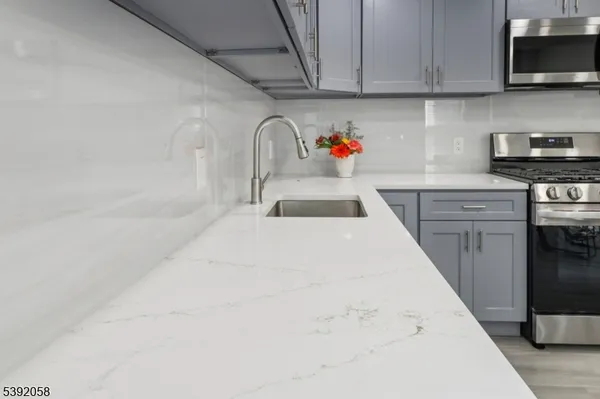 a kitchen with a sink and cabinets