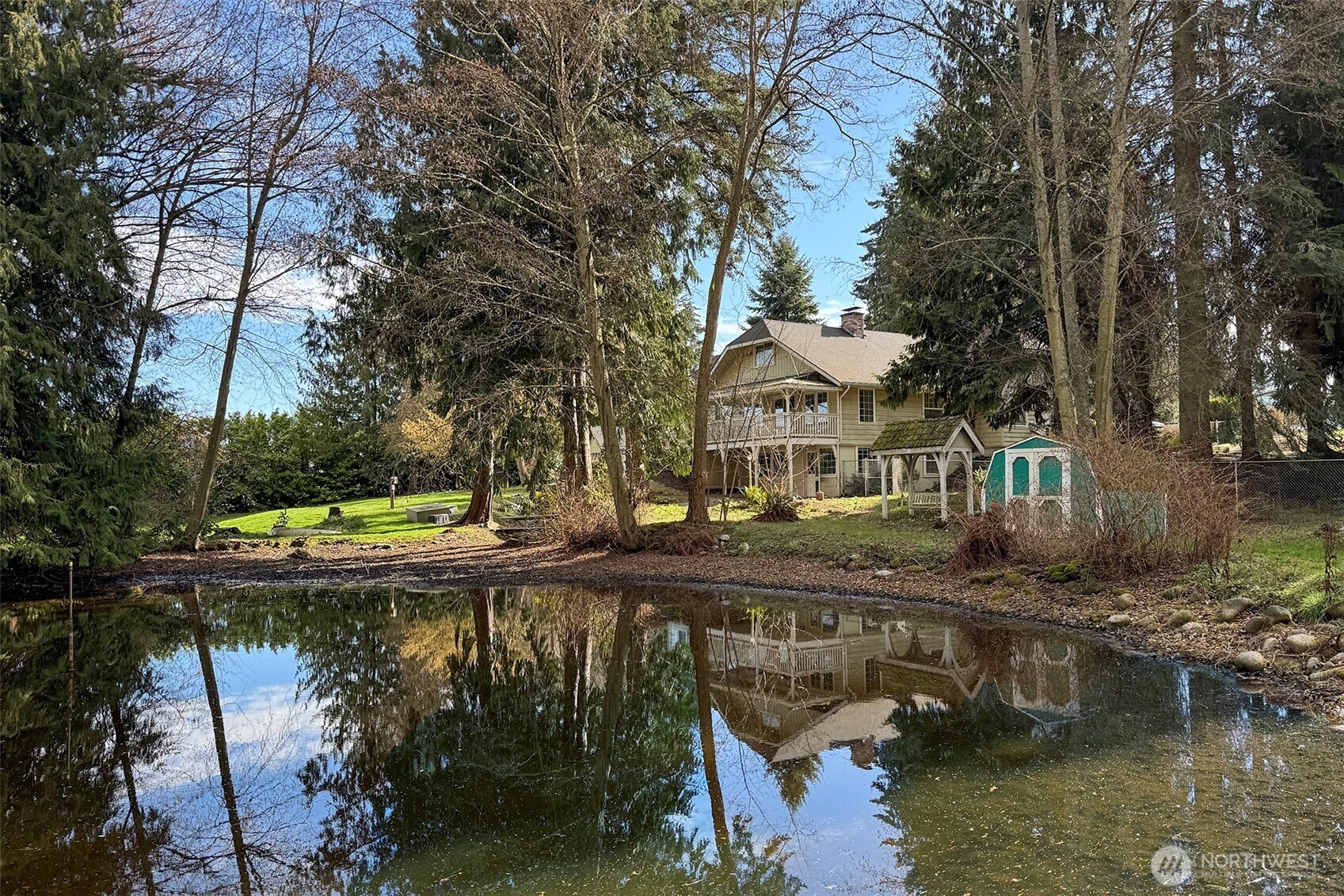 153 Spencer Road Sequim, WA 98382 - Photo 3 of 36 a view of swimming pool with outdoor seating and lake view