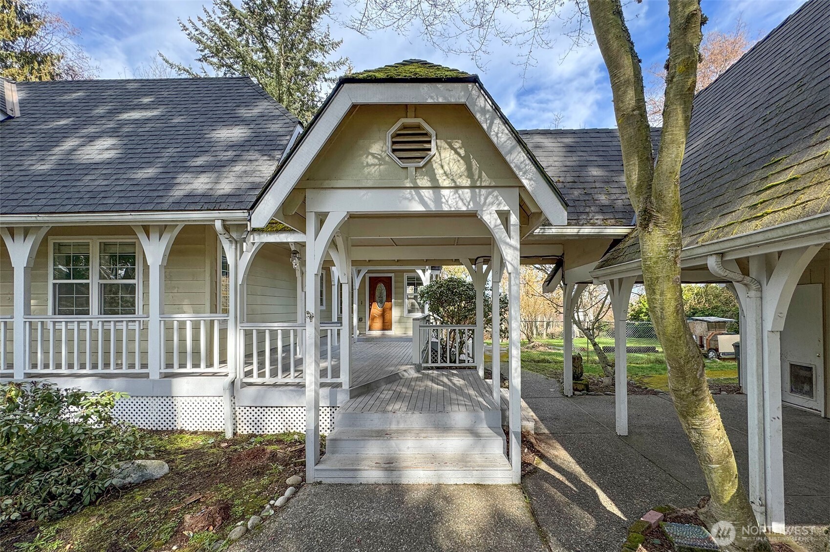 153 Spencer Road Sequim, WA 98382 - Photo 4 of 36 a view of a brick house with a large windows