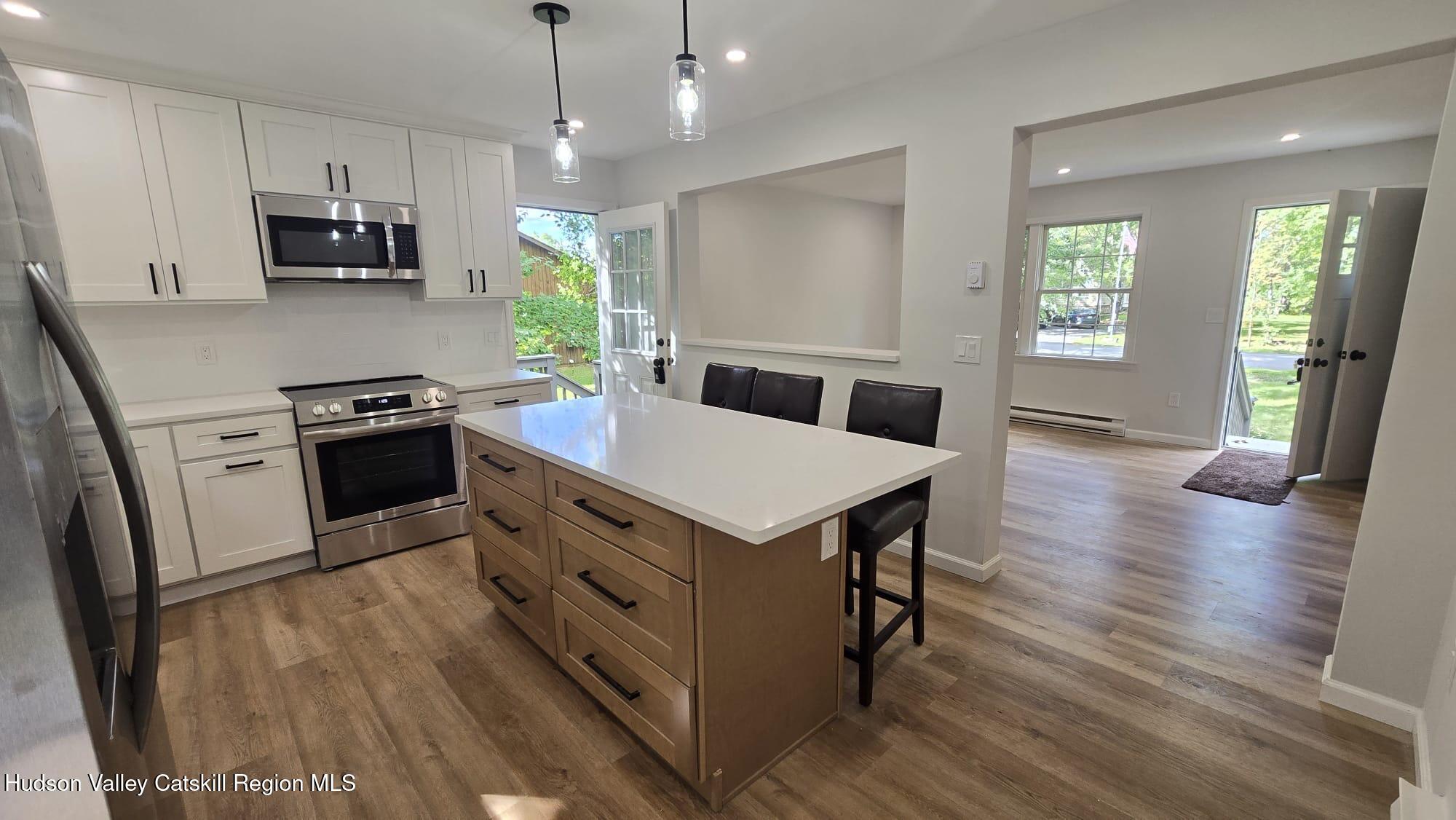 1321 Sleepy Hollow Road Athens, NY 12015 - Photo 2 of 10 a kitchen with a stove a sink and a refrigerator