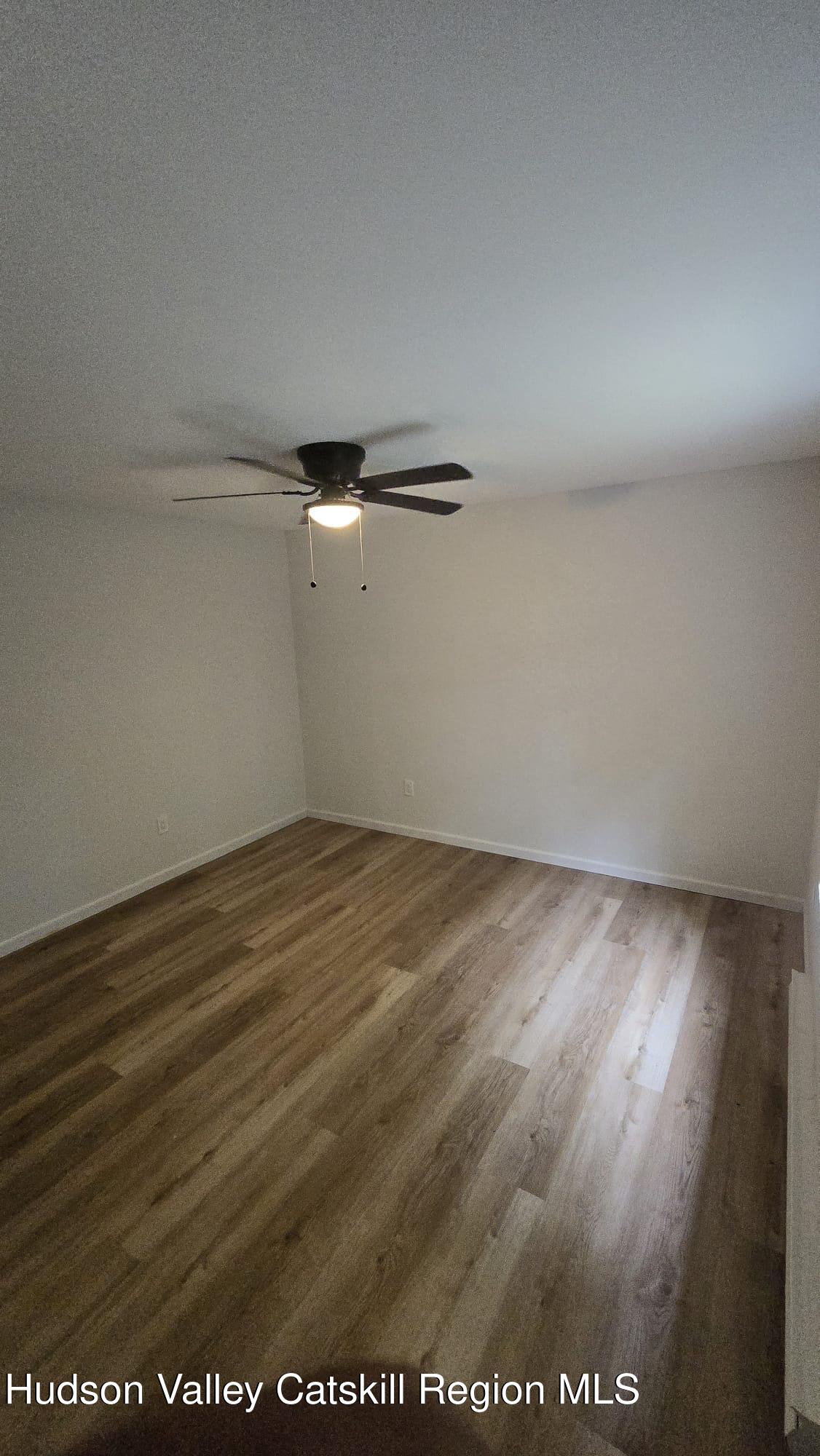 1321 Sleepy Hollow Road Athens, NY 12015 - Photo 8 of 10 an empty room with wooden floor