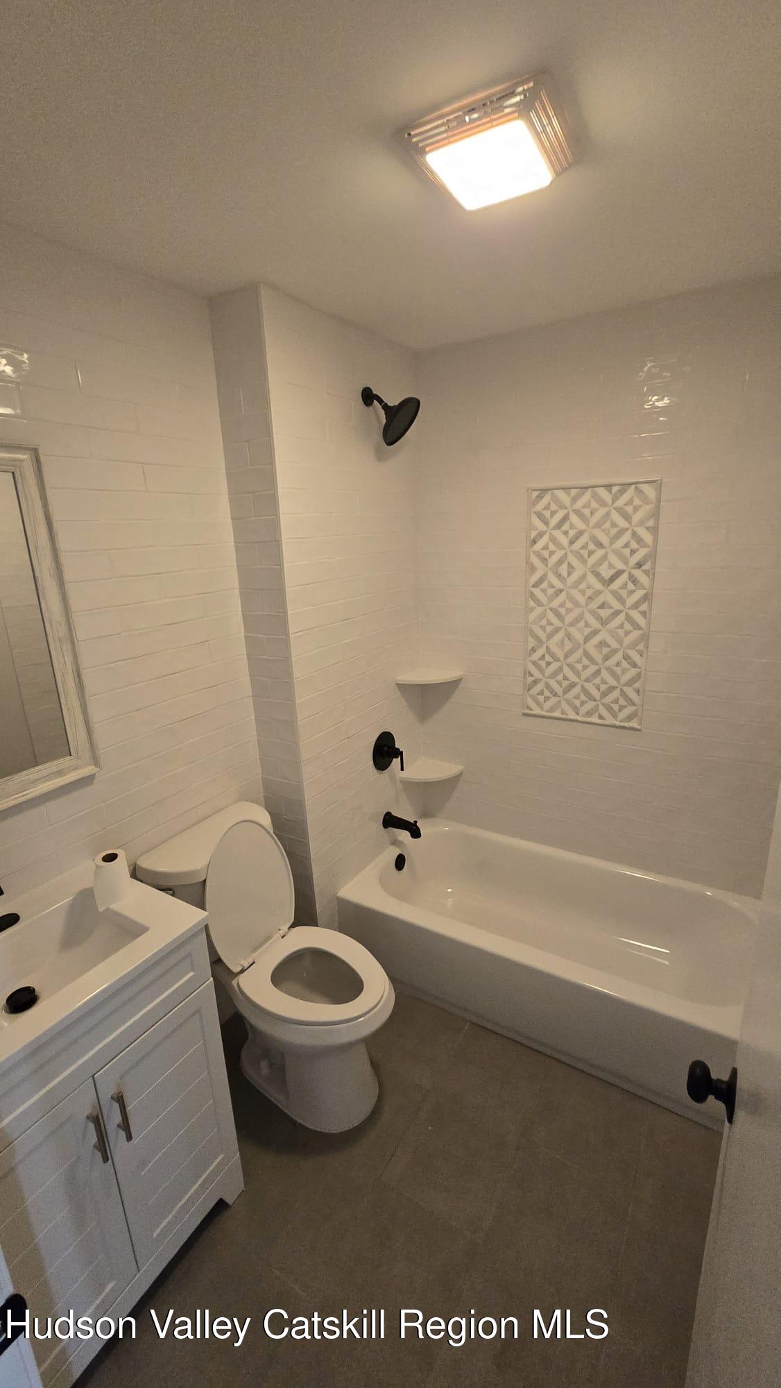 1321 Sleepy Hollow Road Athens, NY 12015 - Photo 9 of 10 a bathroom with a toilet a sink and a bathtub