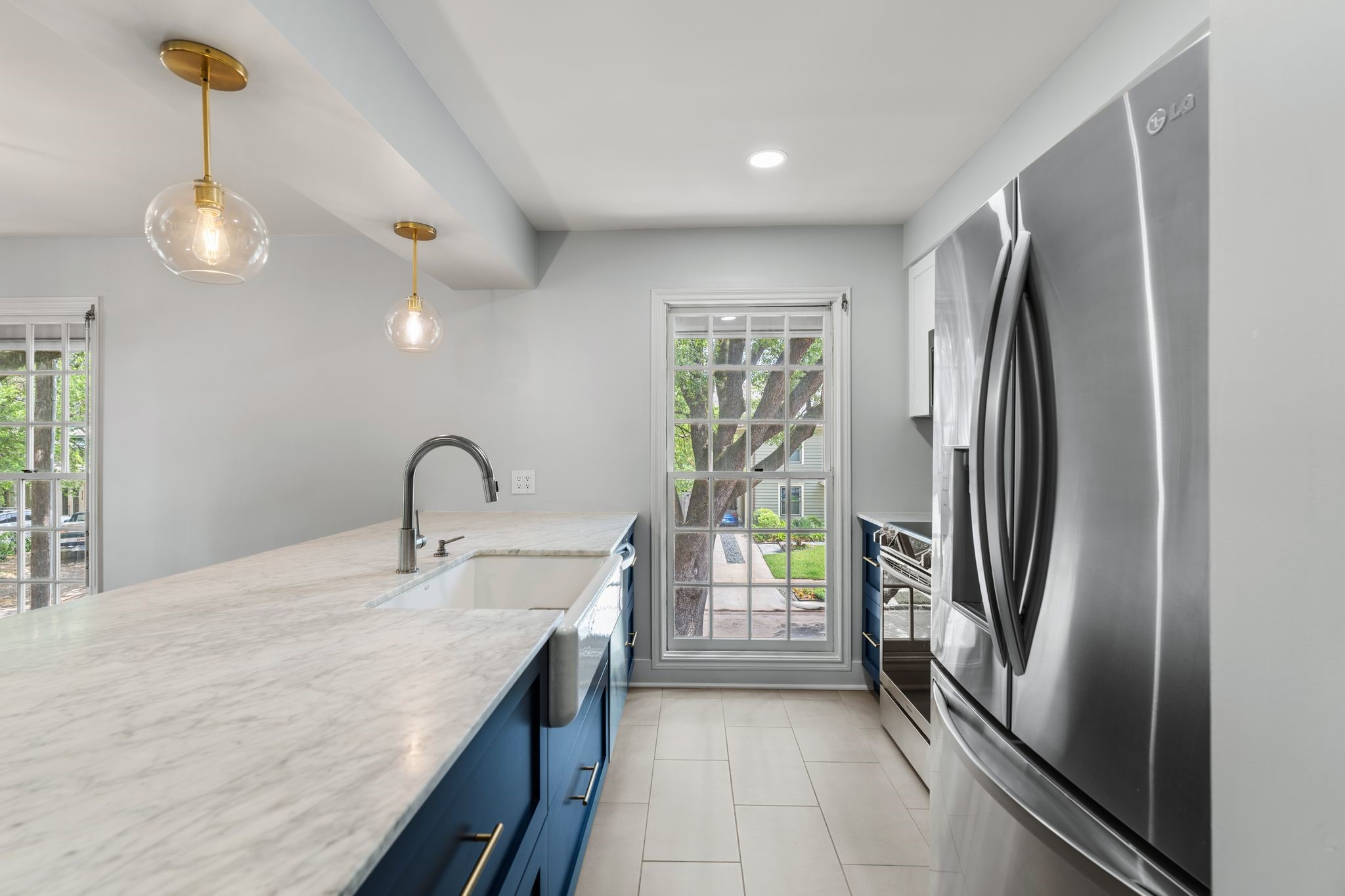 1601 Haver Street Houston, TX 77006 - Photo 11 of 22 The fully updated kitchen is a dream, featuring show stopping shaker-style cabinets, sleek quartz countertops, and stainless steel appliances.