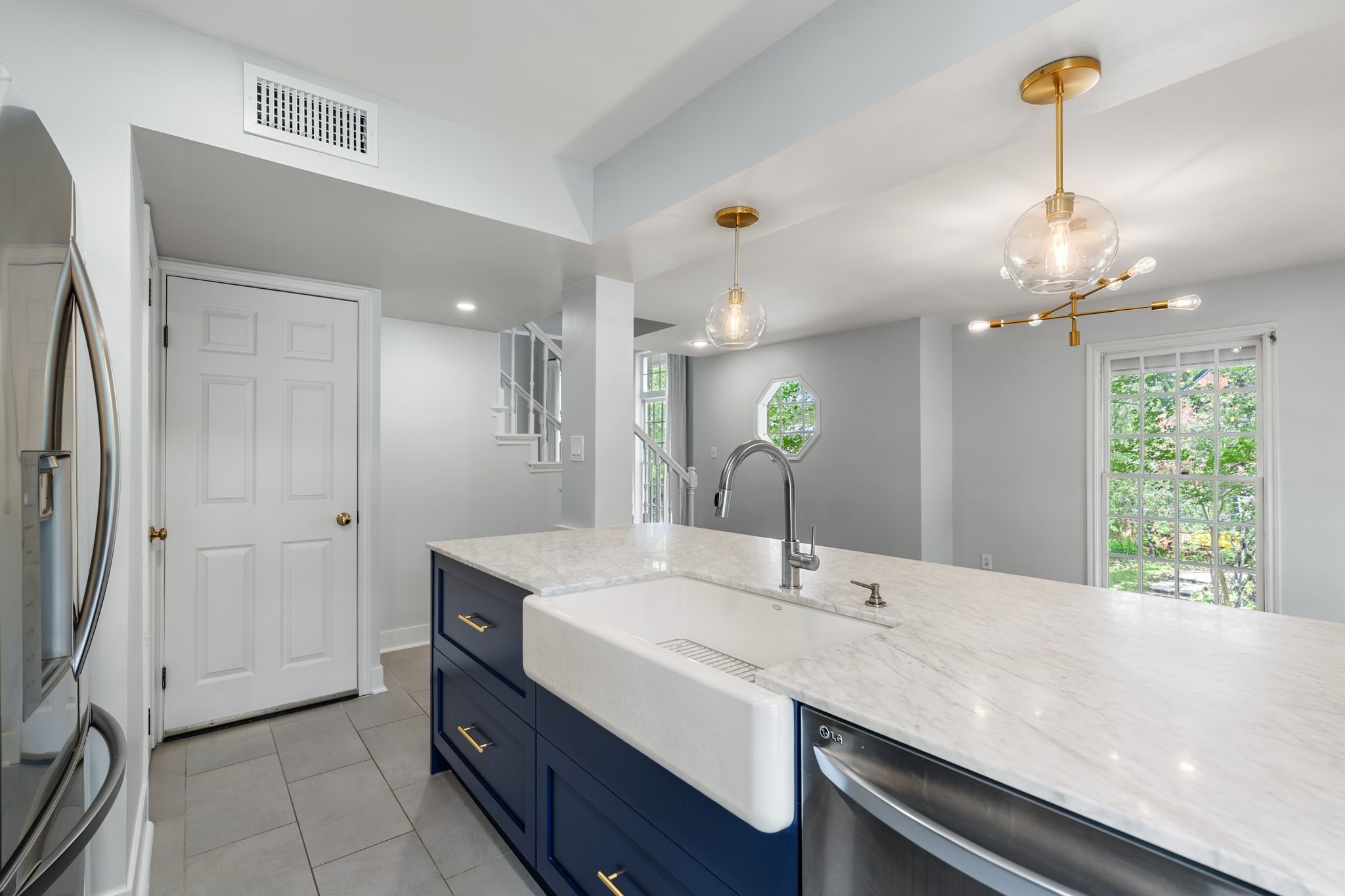 1601 Haver Street Houston, TX 77006 - Photo 12 of 22 A farmhouse sink adds a touch of classic charm, while contemporary lighting enhances the overall ambiance.