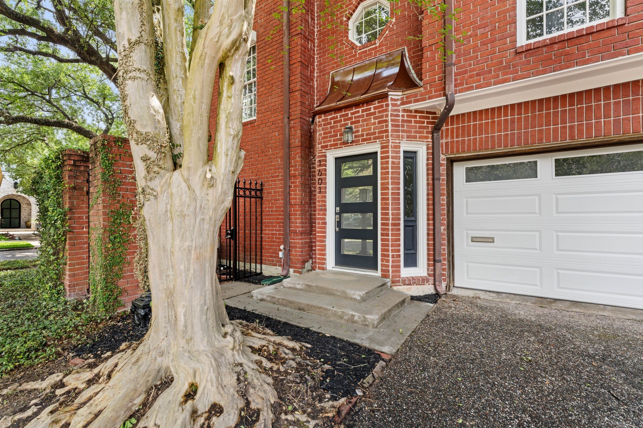 1601 Haver Street Houston, TX 77006 - Photo 2 of 22 Situated on a corner lot, this home is framed by mature, leafy trees that provide shade and a sense of tranquility.