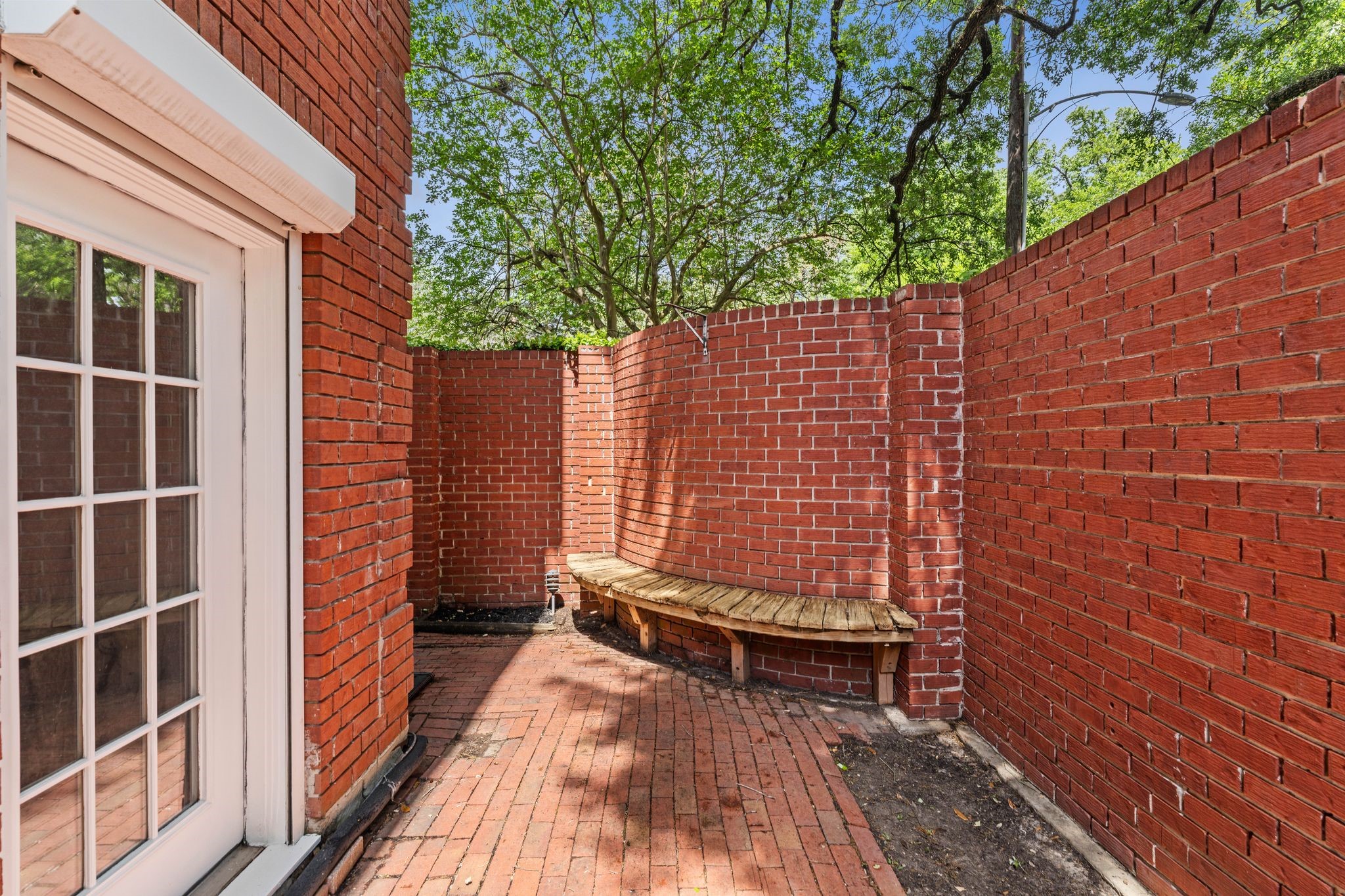 1601 Haver Street Houston, TX 77006 - Photo 20 of 22 The brick not only holds up beautifully to the elements but also provides a cozy, rustic foundation for outdoor furniture.