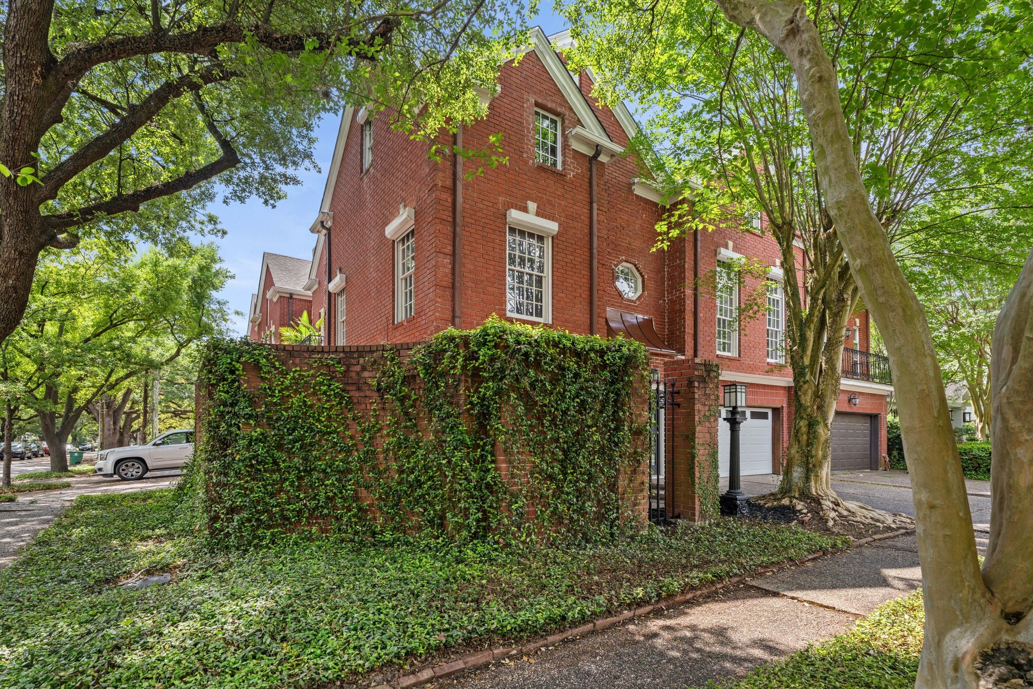 1601 Haver Street Houston, TX 77006 - Photo 21 of 22 The brick fence adorned with cascading ivy adds a storybook-like charm while maintaining privacy.
