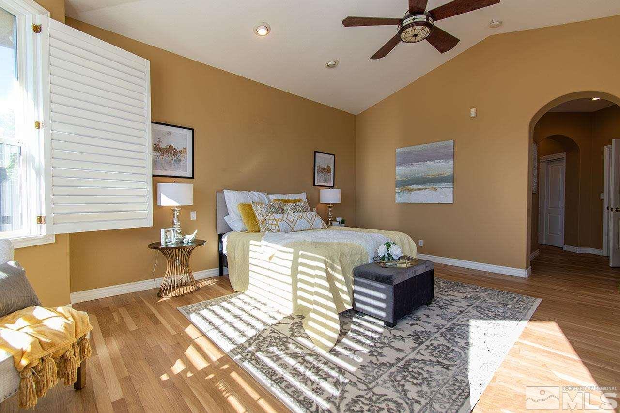 12640 Fieldcreek Lane Reno, NV 89511 - Photo 28 of 37 a bedroom with a bed and wooden floor