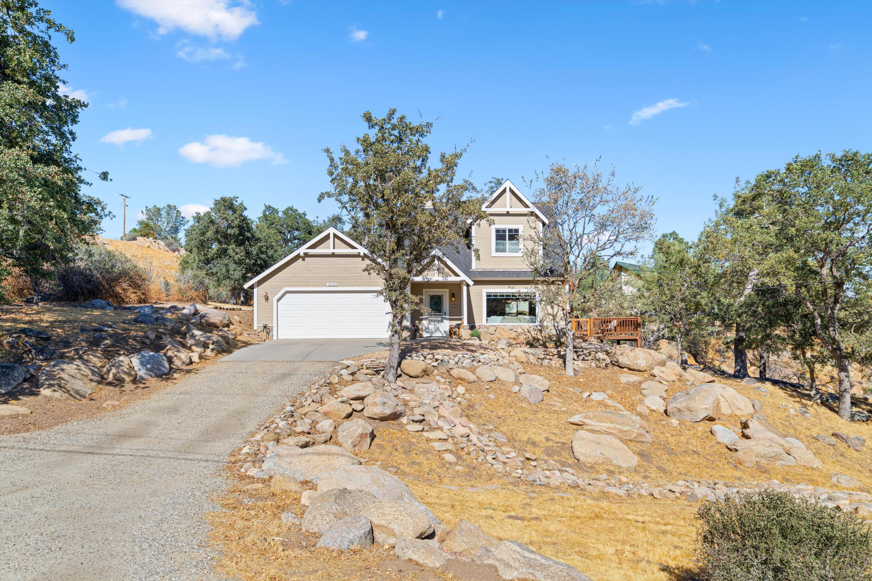 21605 Quail Springs Road Tehachapi, CA 93561 - Photo 26 of 35 a front view of a house with a yard