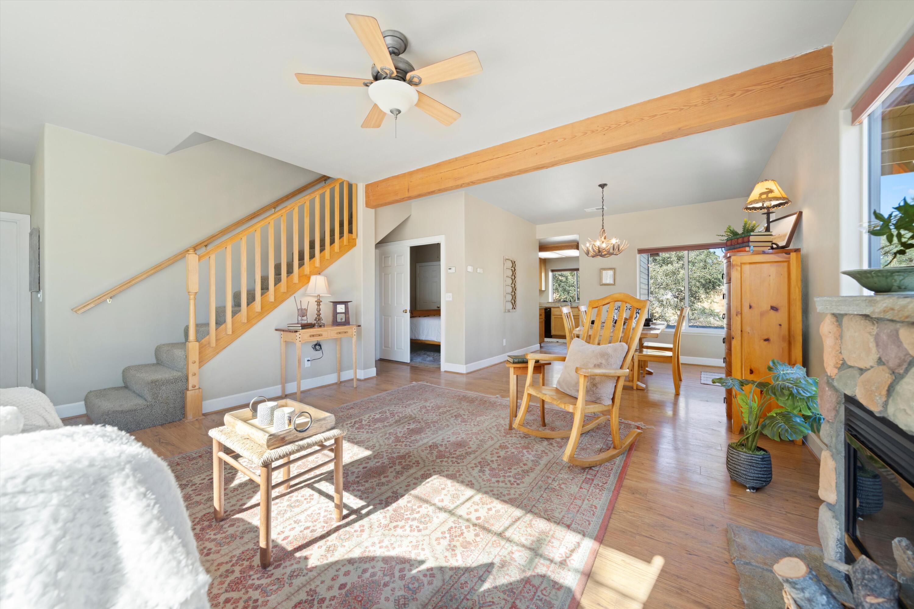 21605 Quail Springs Road Tehachapi, CA 93561 - Photo 5 of 35 a view of a livingroom with furniture a rug wooden floor and a chandelier