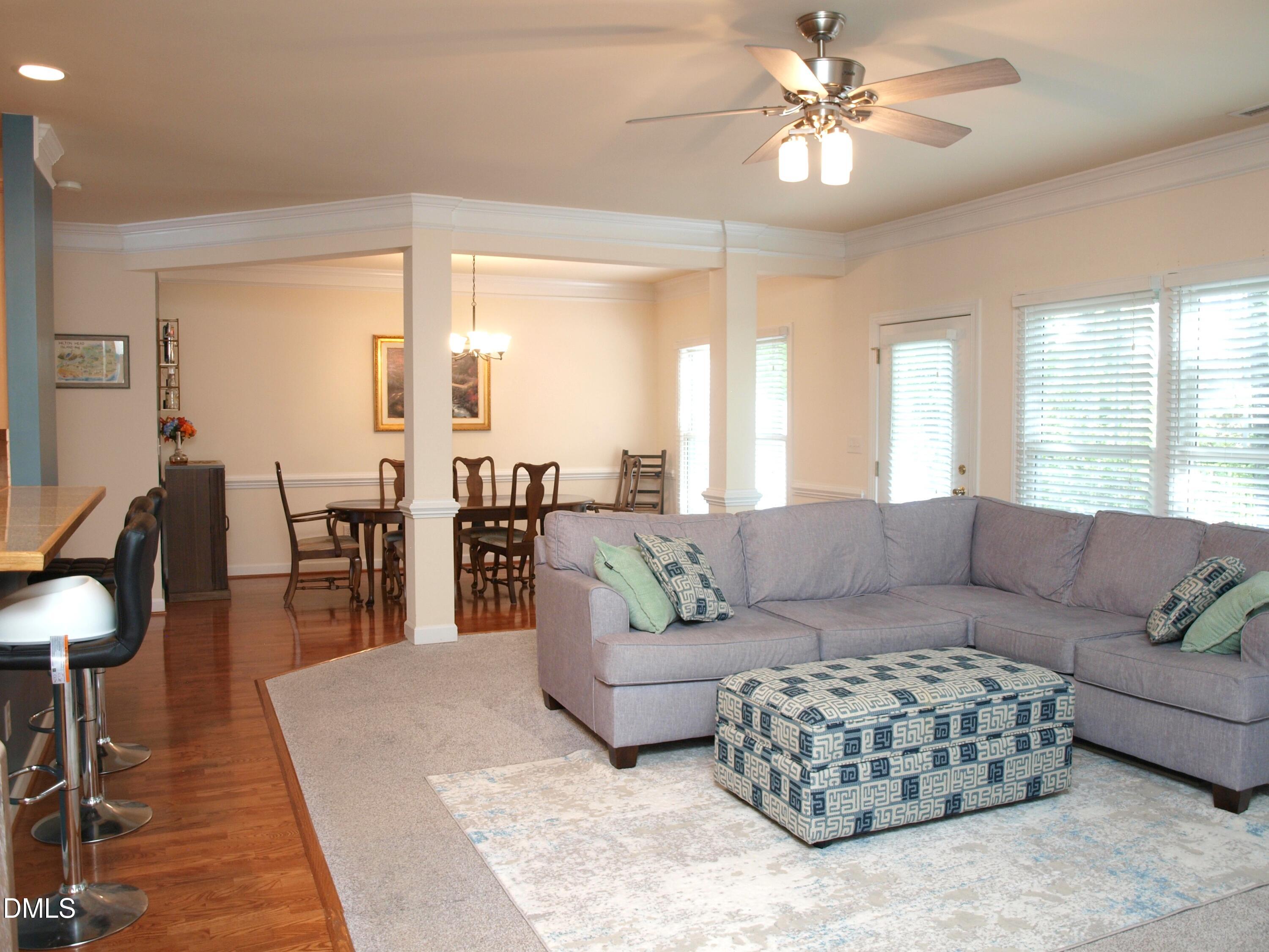 5206 Rio Grande Drive Raleigh, NC 27616 - Photo 11 of 37 a living room with furniture and a chandelier