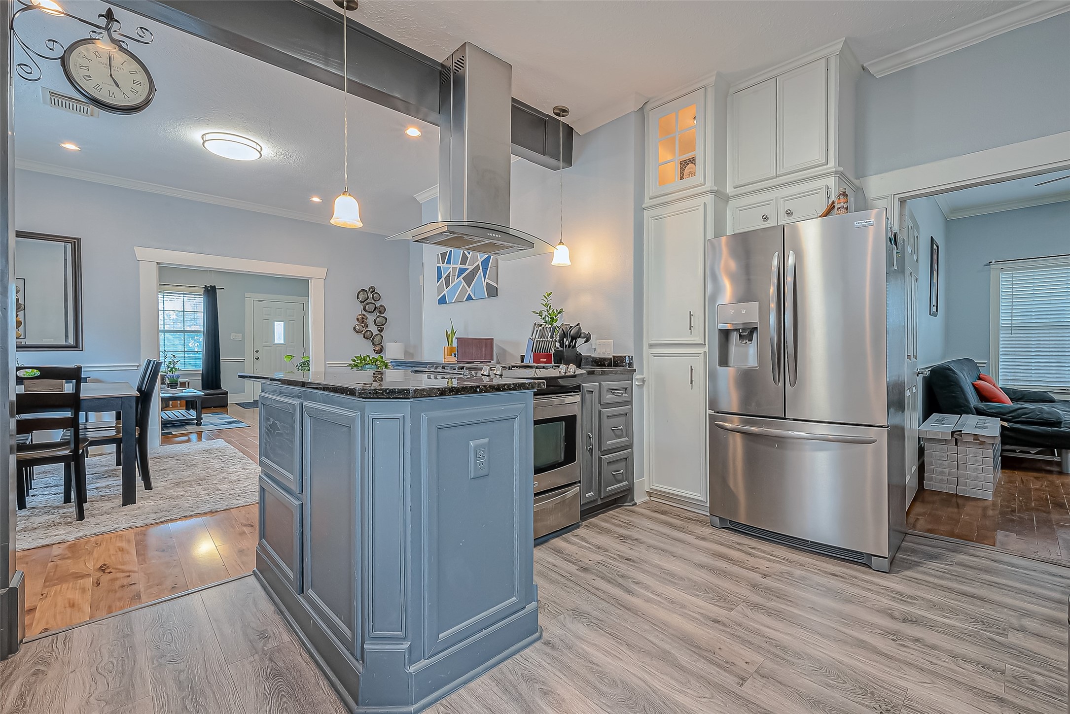 118 Jenkins Street Houston, TX 77003 - Photo 10 of 28 a kitchen with stainless steel appliances granite countertop a refrigerator a stove a sink and a dining table with wooden floor