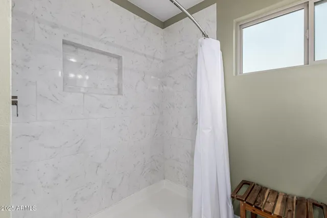 en empty room with fan and window