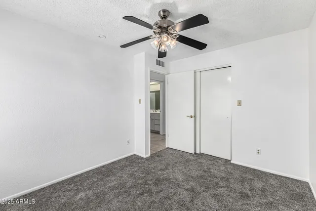 an empty room with fan