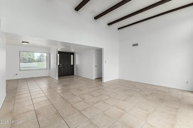 a view of an empty room and window