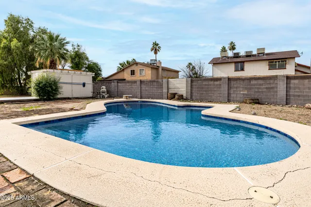 a view of a backyard of the house