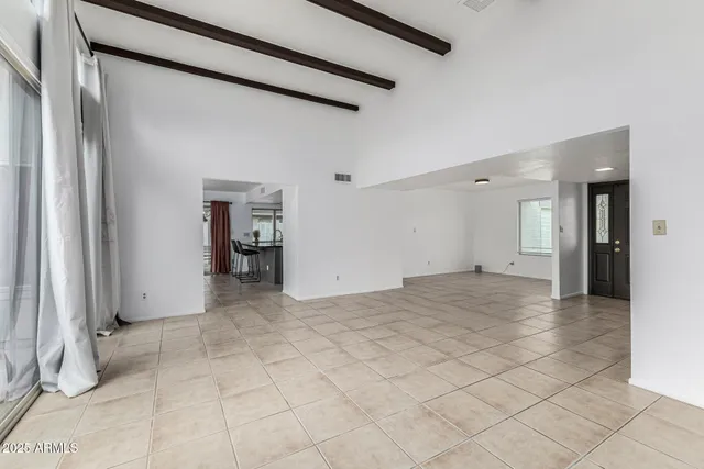 a view of an empty room with a large window