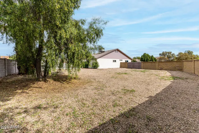 a view of garage and yard