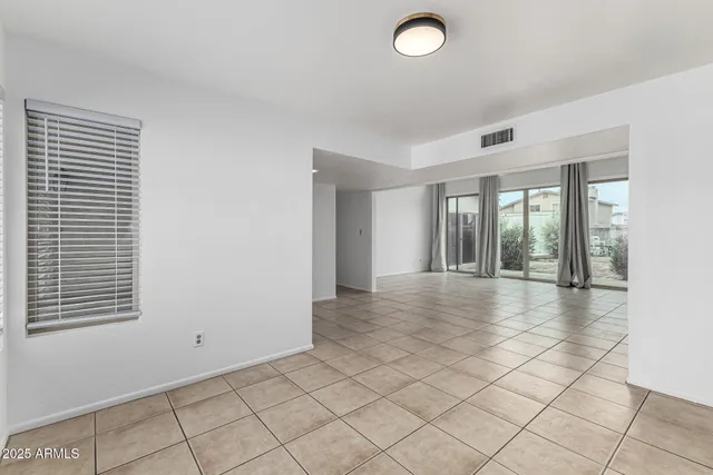 a view of an empty room and window