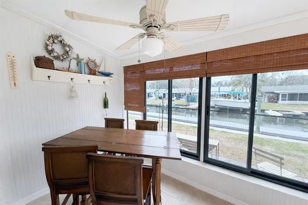 a view of a dining room with a table and chairs