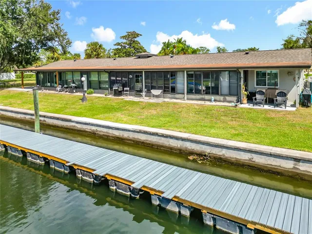 a view of swimming pool with outdoor seating and yard