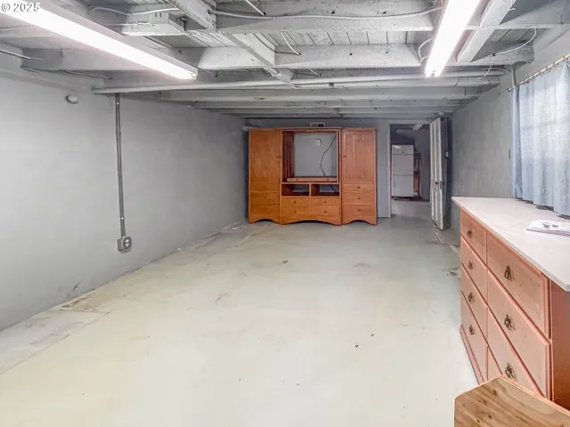 a view of an empty room with wooden walls