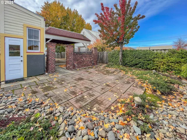 a front view of a house with a yard and a garage