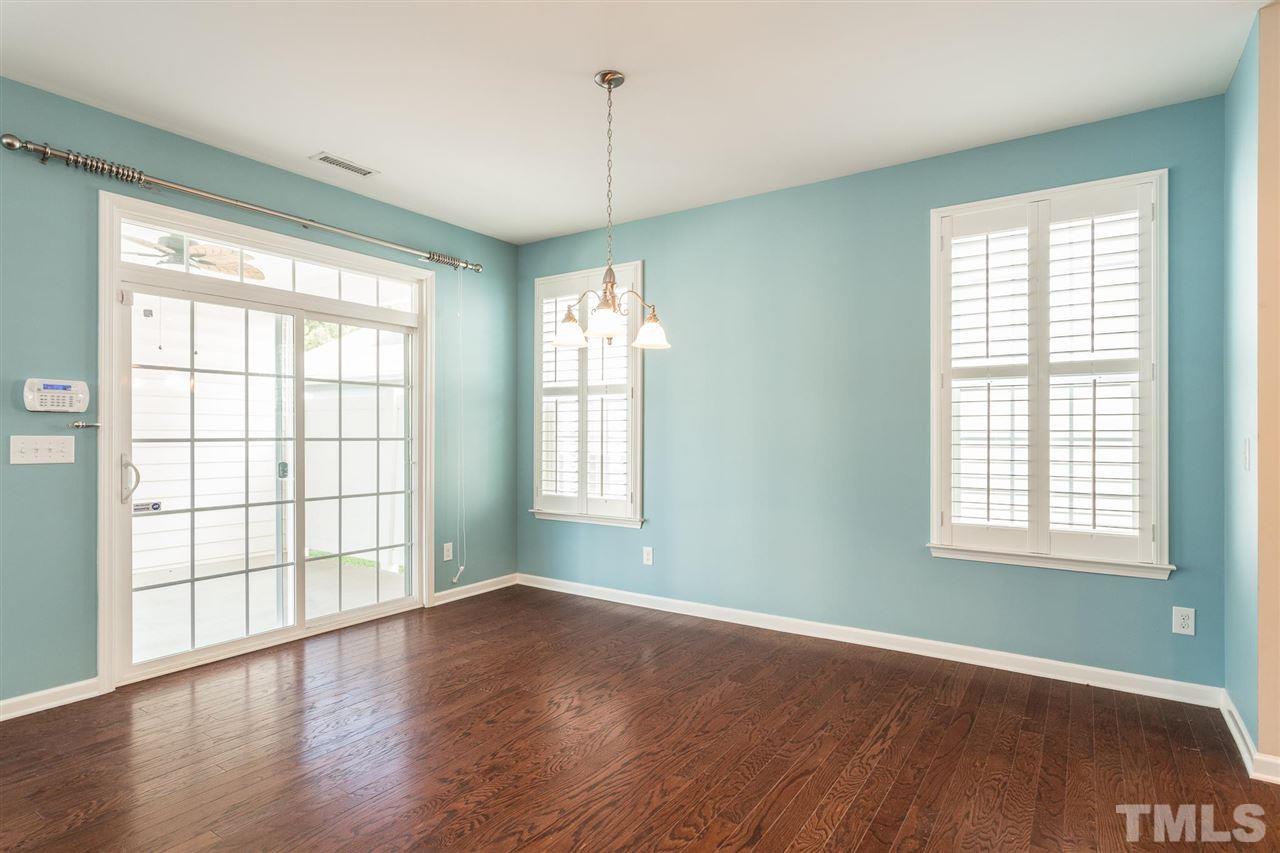 1100 Ileagnes Road Raleigh, NC 27603 - Photo 3 of 22 a view of an empty room with wooden floor and a window