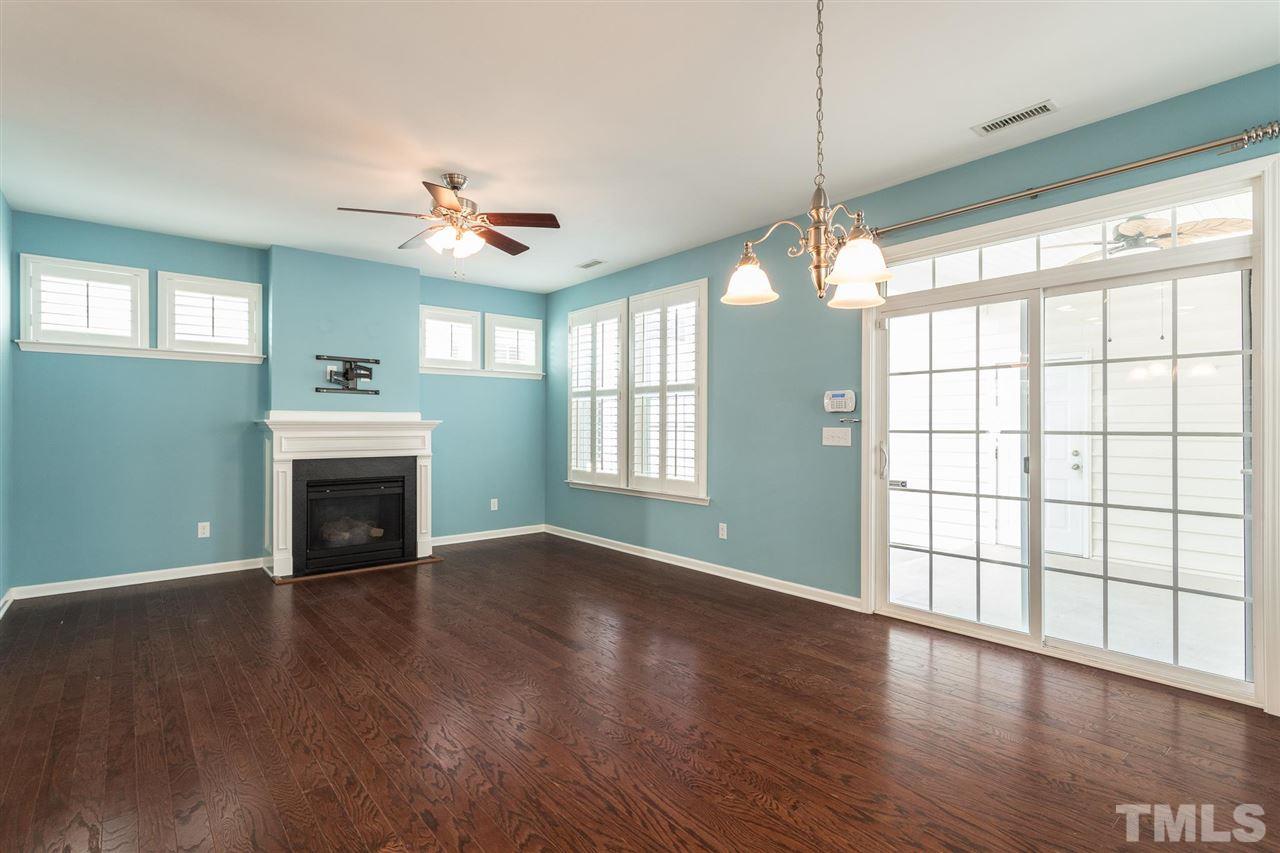 1100 Ileagnes Road Raleigh, NC 27603 - Photo 4 of 22 a view of an empty room with window and wooden floor