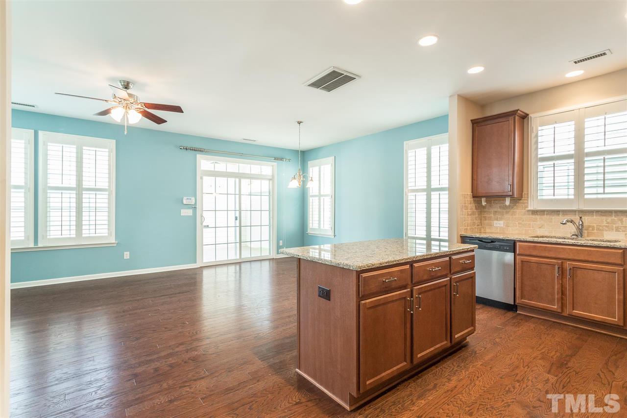 1100 Ileagnes Road Raleigh, NC 27603 - Photo 6 of 22 a kitchen that has a sink and a stove in it