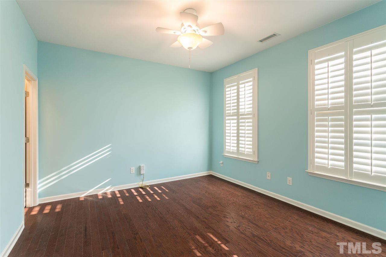 1100 Ileagnes Road Raleigh, NC 27603 - Photo 10 of 22 a view of room with window and ceiling fan