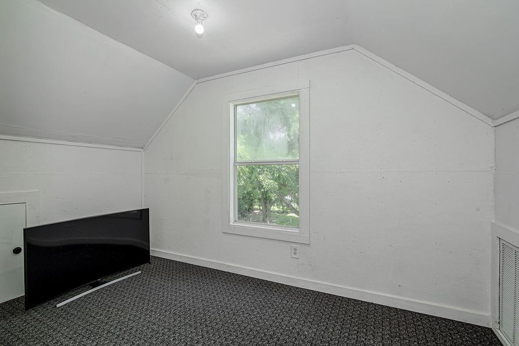 9801 Bellechase Road Granbury, TX 76049 - Photo 25 of 40 a view of an empty room with a window
