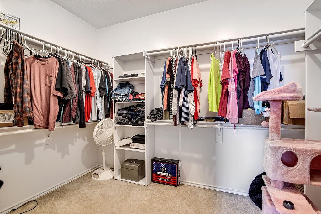 9801 Bellechase Road Granbury, TX 76049 - Photo 30 of 40 a view of walk in closet with clothes