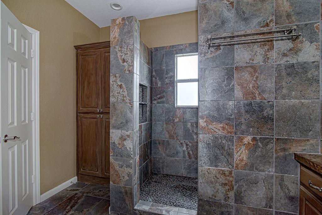9801 Bellechase Road Granbury, TX 76049 - Photo 33 of 40 a bathroom with a shower