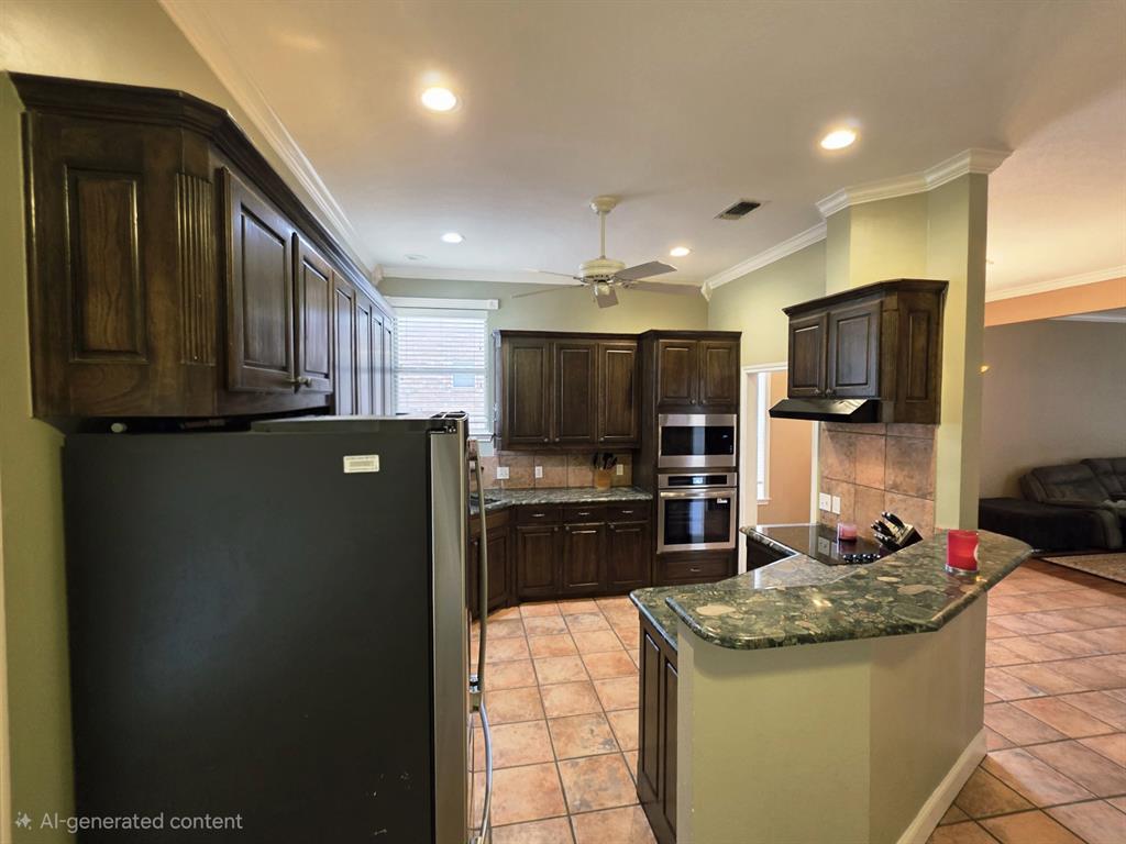 9801 Bellechase Road Granbury, TX 76049 - Photo 38 of 40 a kitchen with stainless steel appliances granite countertop a refrigerator a stove a sink and a microwave