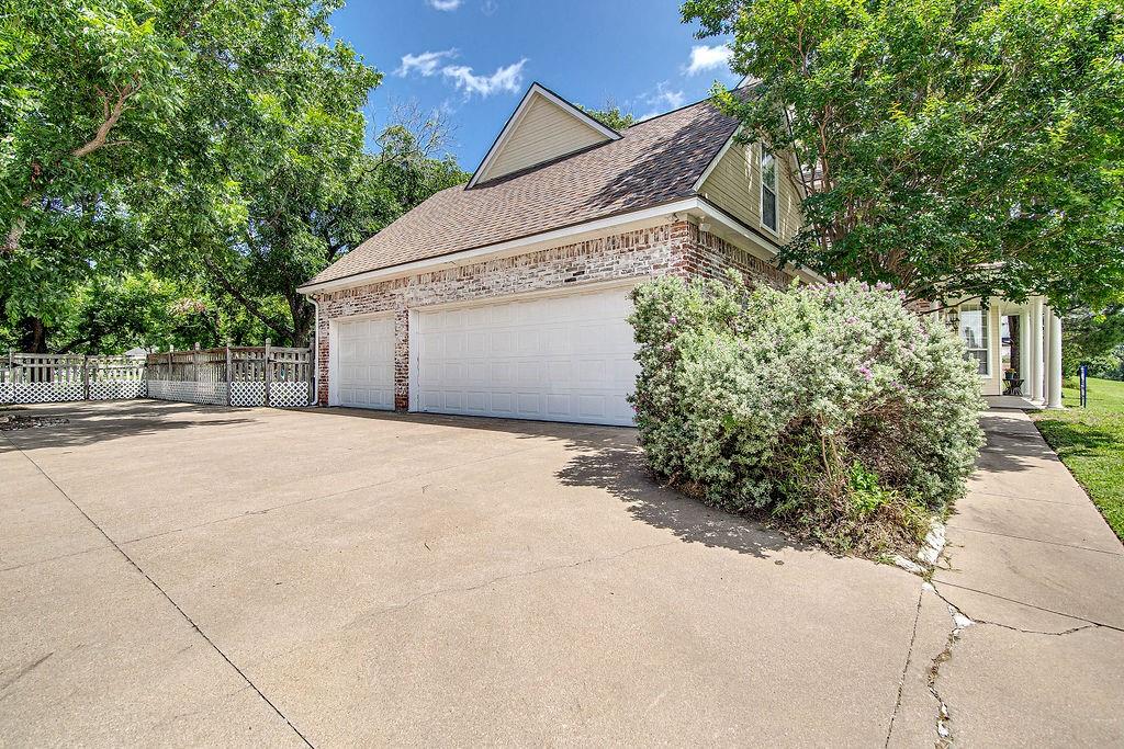 9801 Bellechase Road Granbury, TX 76049 - Photo 5 of 40 a backyard of a house with lots of green space