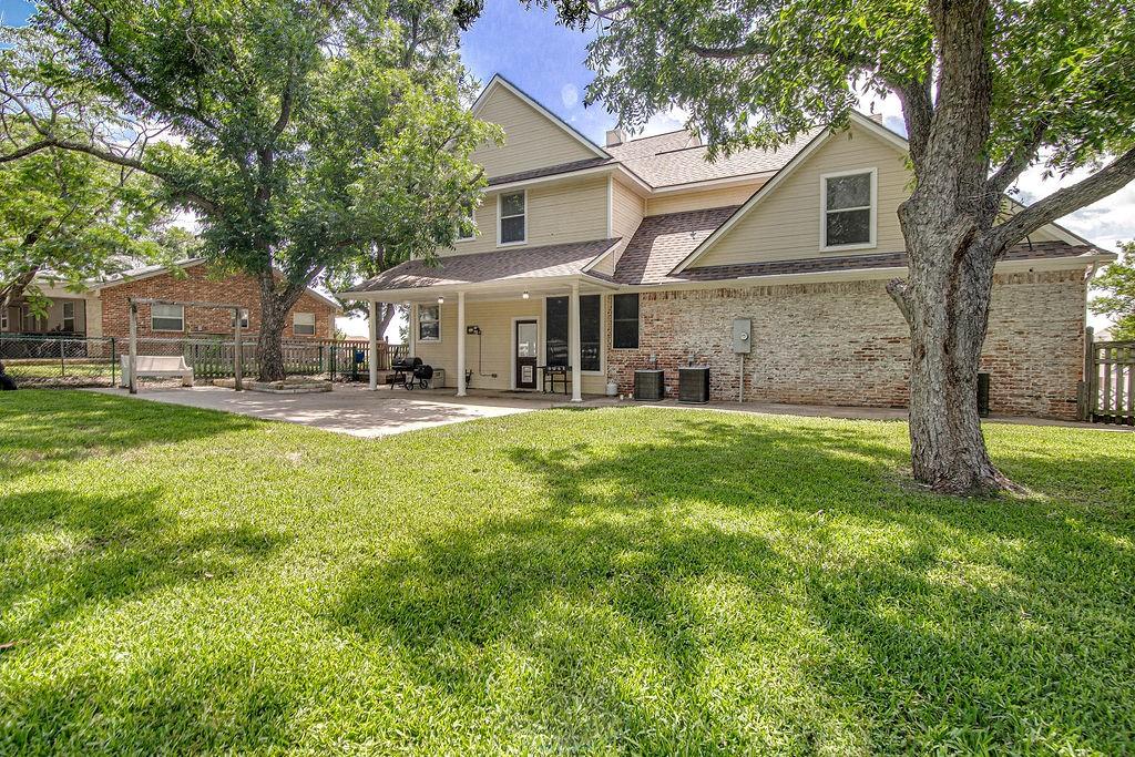9801 Bellechase Road Granbury, TX 76049 - Photo 7 of 40 a front view of house with yard and green space
