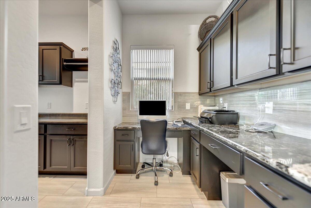 17943 East Silver Sage Lane Rio Verde, AZ 85263 - Photo 14 of 66 a kitchen with stainless steel appliances granite countertop a stove sink and cabinets