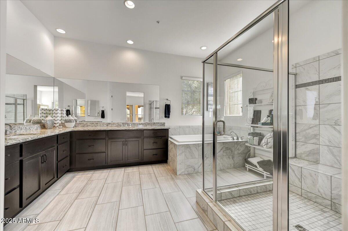 17943 East Silver Sage Lane Rio Verde, AZ 85263 - Photo 18 of 66 a large bathroom with a glass shower door