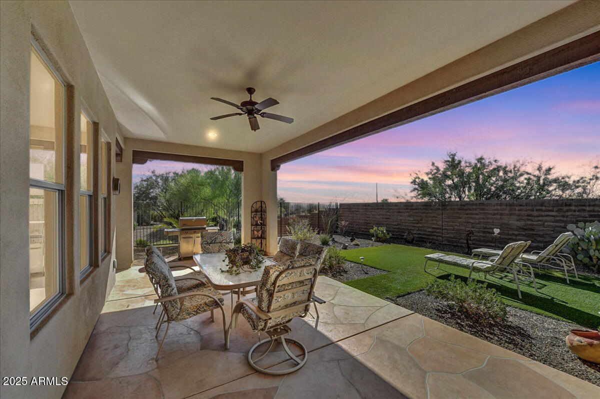 17943 East Silver Sage Lane Rio Verde, AZ 85263 - Photo 24 of 66 a view of a porch with furniture and yard