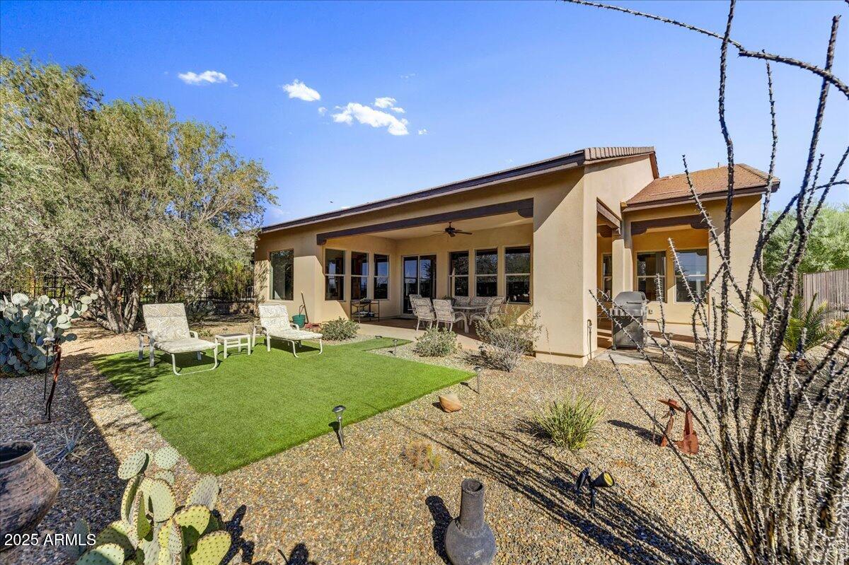 17943 East Silver Sage Lane Rio Verde, AZ 85263 - Photo 30 of 66 a view of a house with backyard porch and sitting area