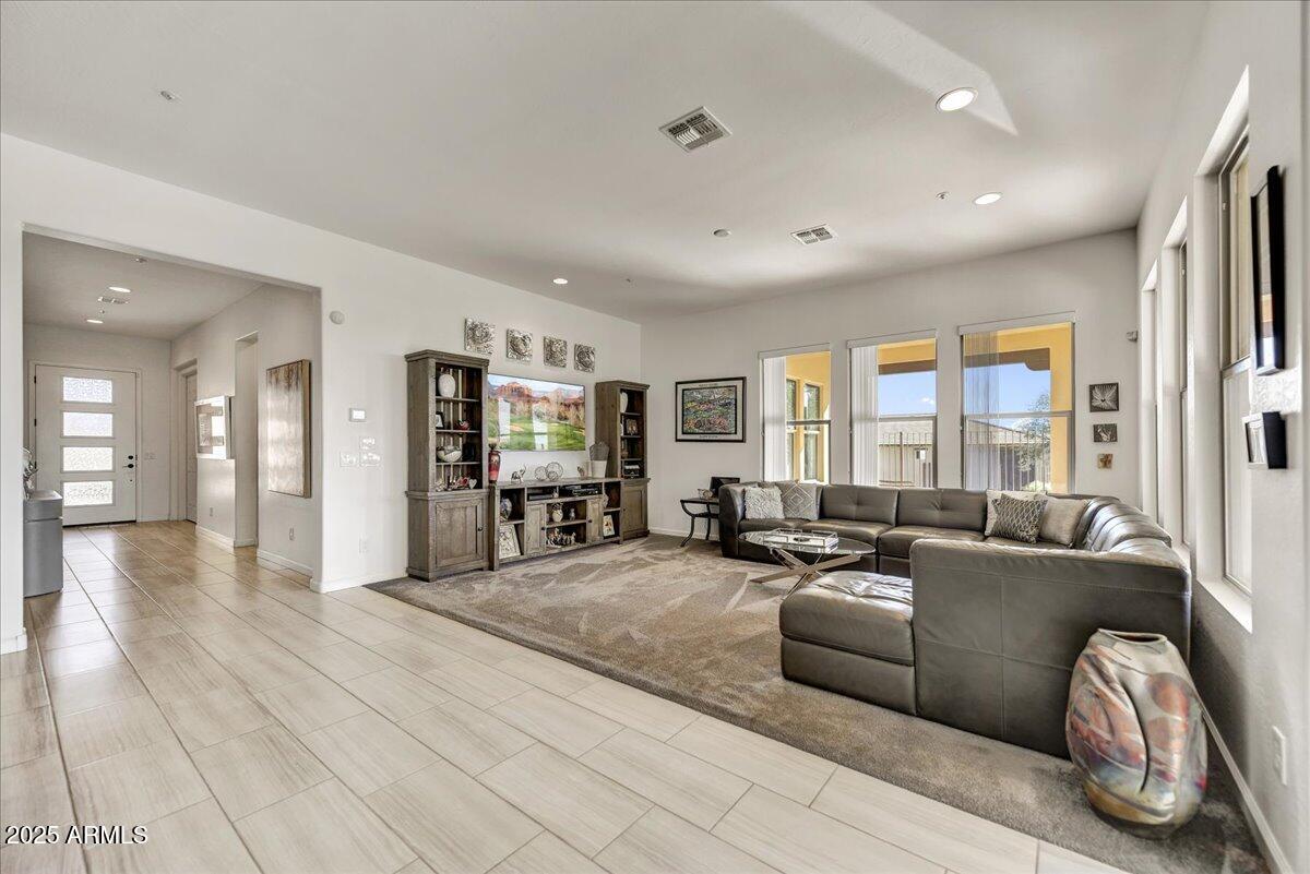 17943 East Silver Sage Lane Rio Verde, AZ 85263 - Photo 8 of 66 a living room with furniture and a table