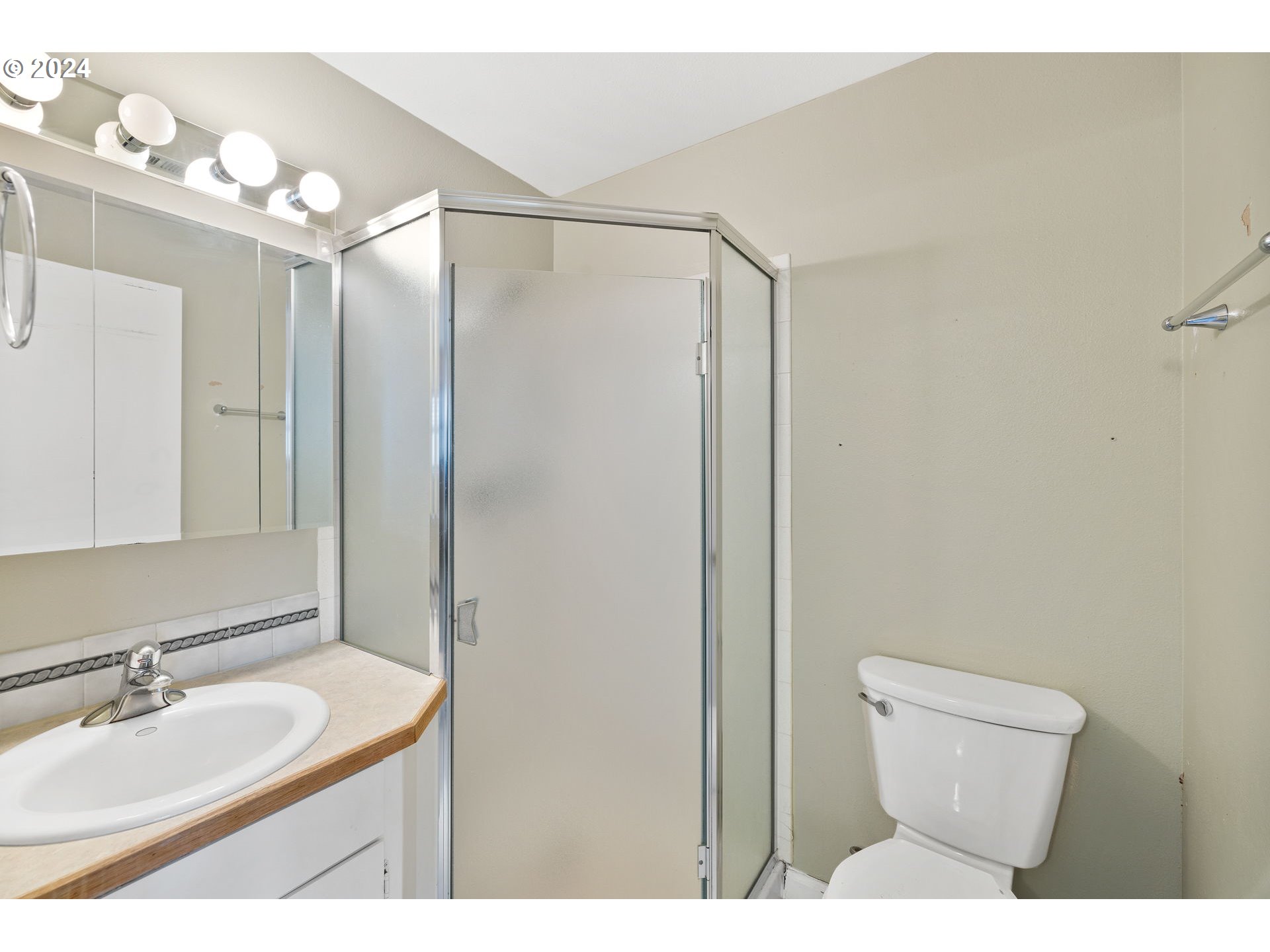 12871 Southeast Stark Street, Unit A16 Portland, OR 97233 - Photo 13 of 20 a bathroom with a sink and a mirror