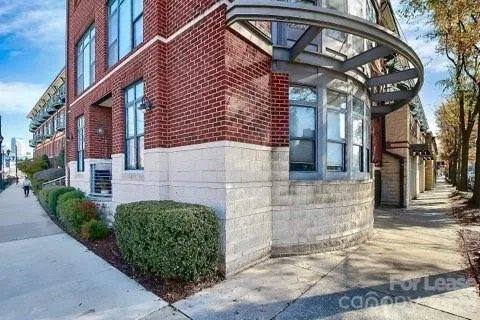 a view of a brick building with many windows