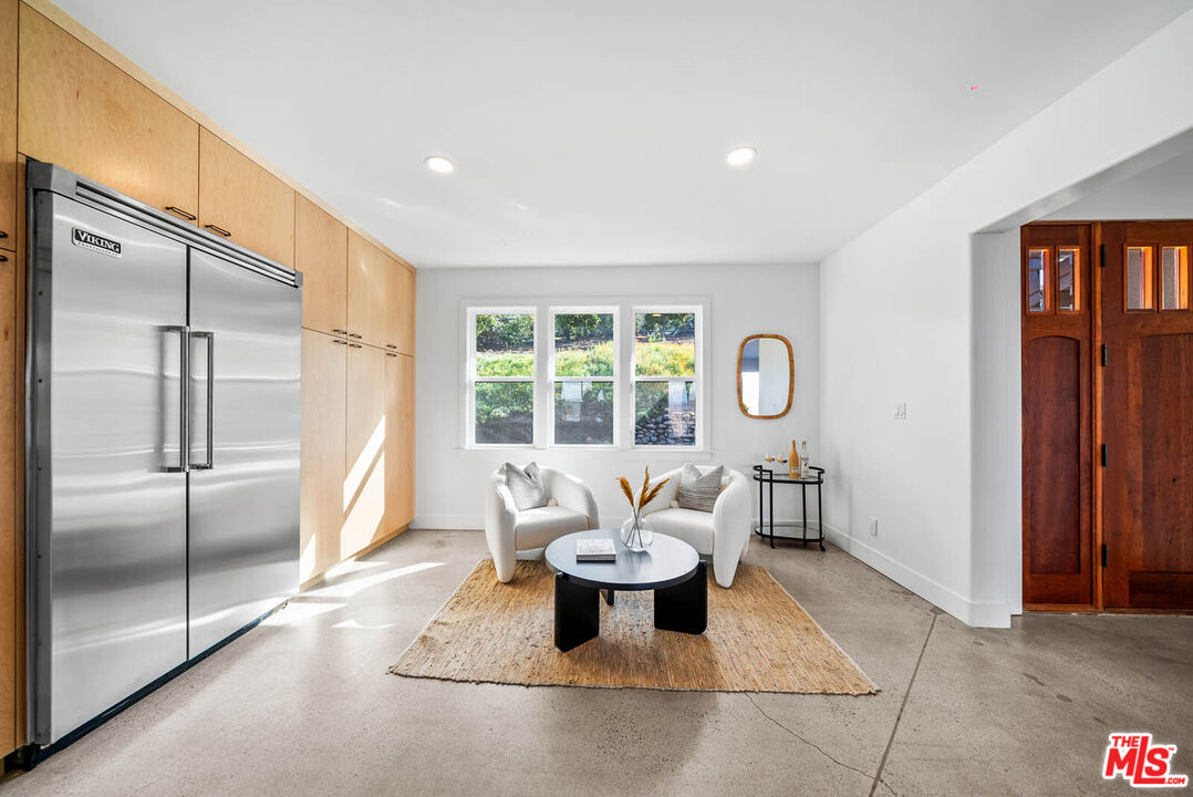 32070 Vía Vera Bonsall, CA 92003 - Photo 15 of 75 a living room with furniture and a window