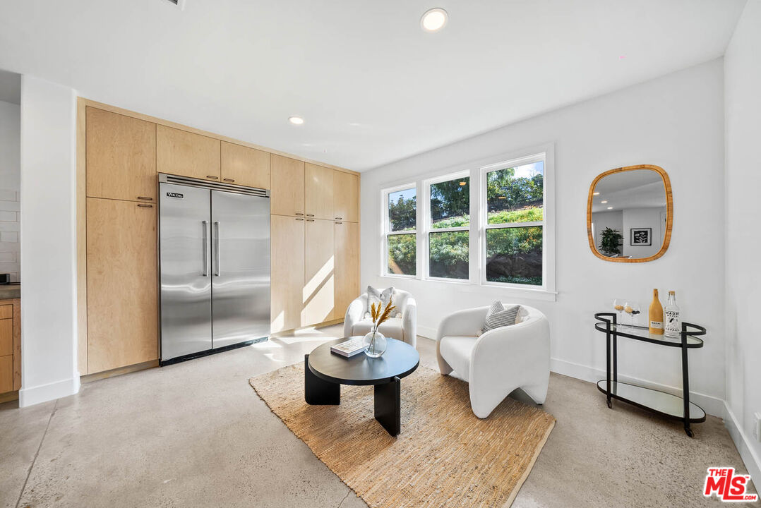 32070 Vía Vera Bonsall, CA 92003 - Photo 17 of 75 a living room with furniture and a large window