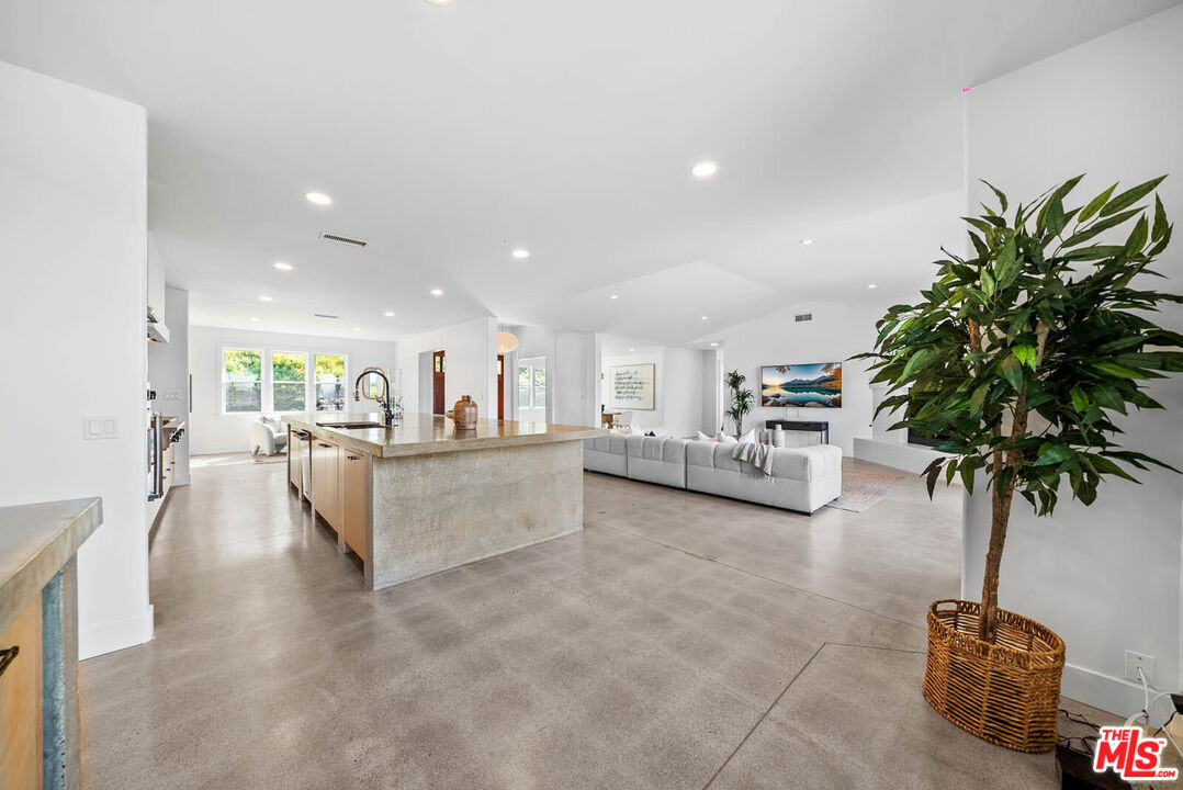 32070 Vía Vera Bonsall, CA 92003 - Photo 20 of 75 a living room with furniture and a potted plant